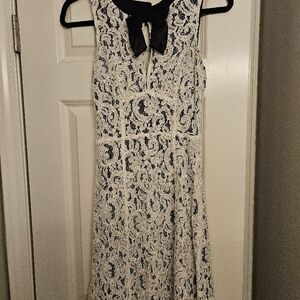 Elegant White Lace Dress with Black Bow